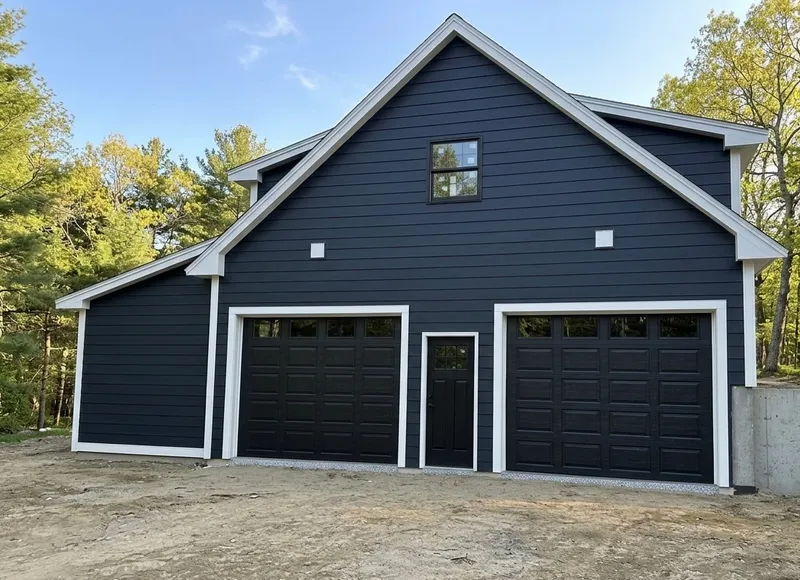 Navy new-construction garage with two single doors